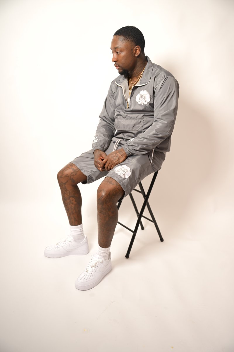 Bold Boy seated in the grey Mentionaire set